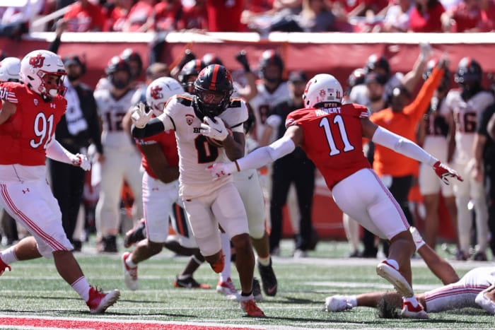 Oregon State Beavers wide receiver Tre'Shaun Harrison (0) runs past Utah Utes safety R.J. Hubert (11) in the second quarter at Rice-Eccles Stadium.